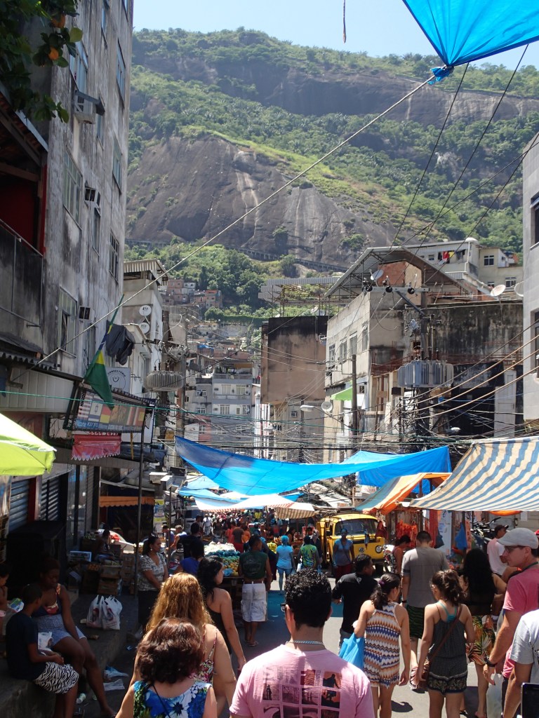 A vibrant city market attracting customers from all over, much like a farmer's market in the states.