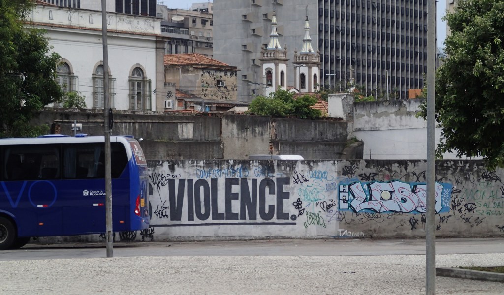 Full sign was "Money is Violence" but I like "Bus Violence." It s rare to see murals in English.